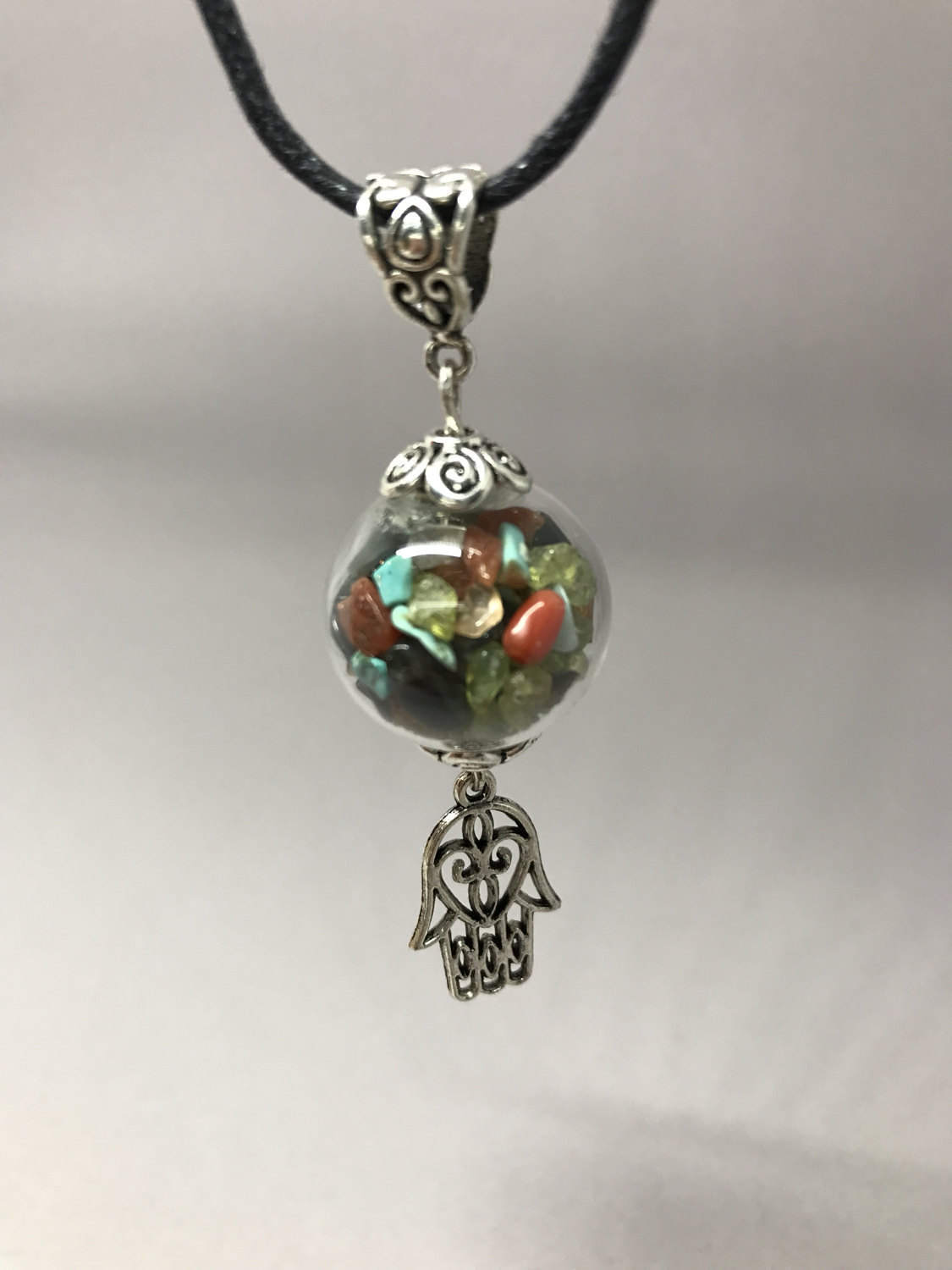 Protection charm bottle necklace, with Fatima hand.
