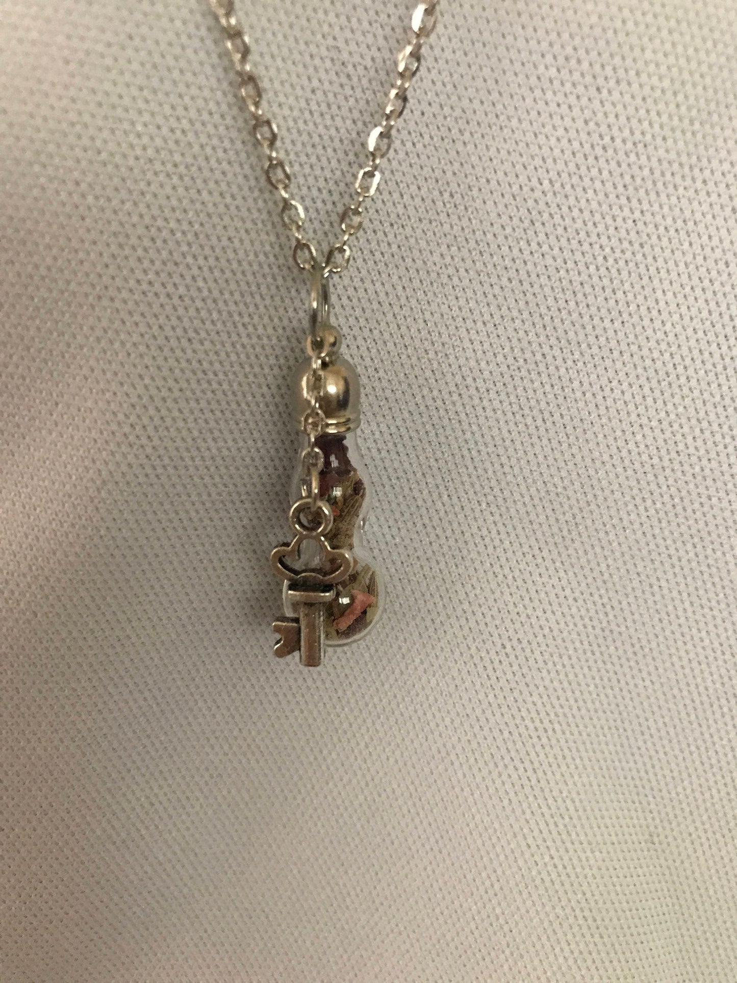 Talisman necklace, a love charm bottle