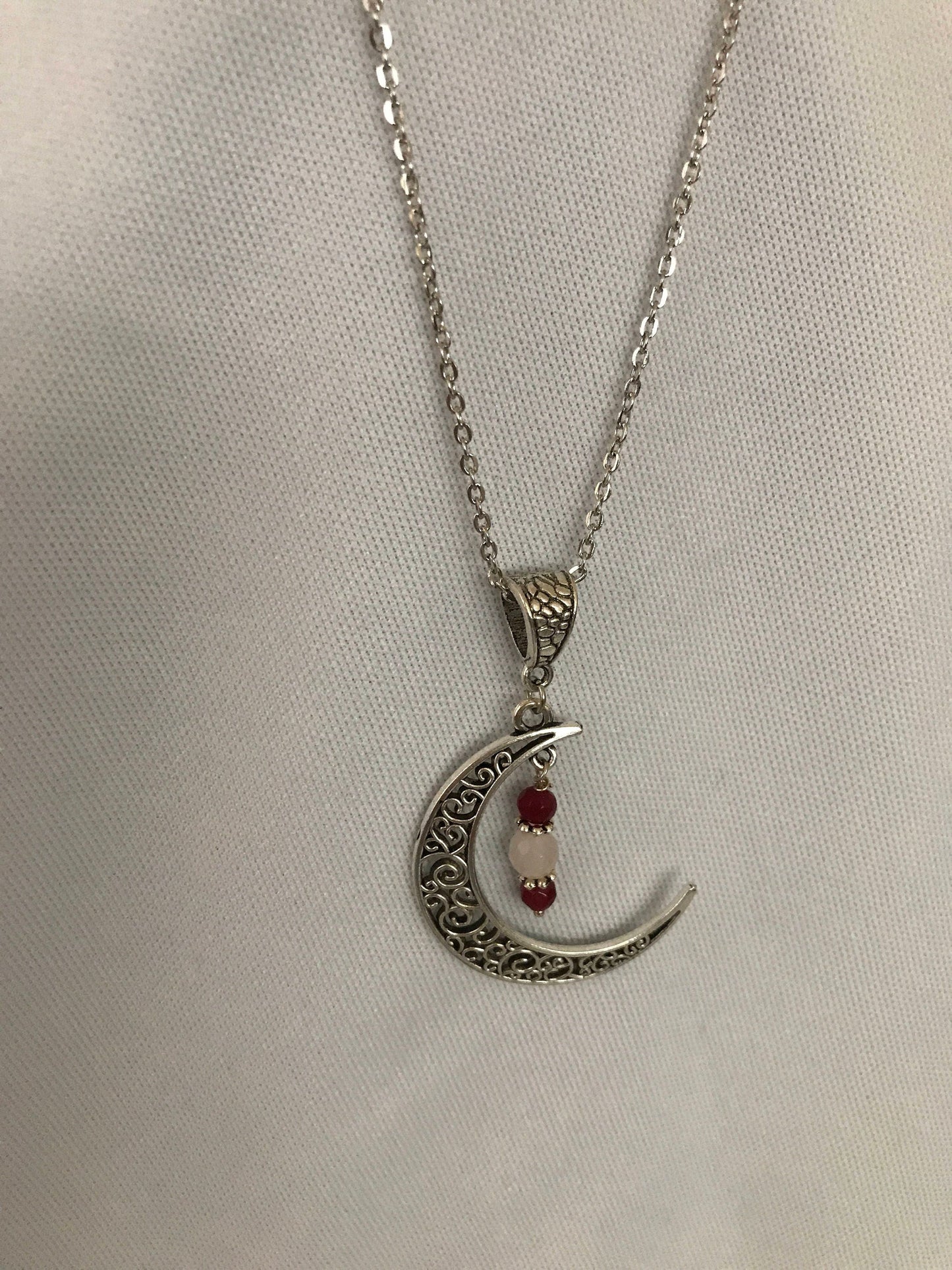 Silver filigree moon pendant with garnet and rose quartz