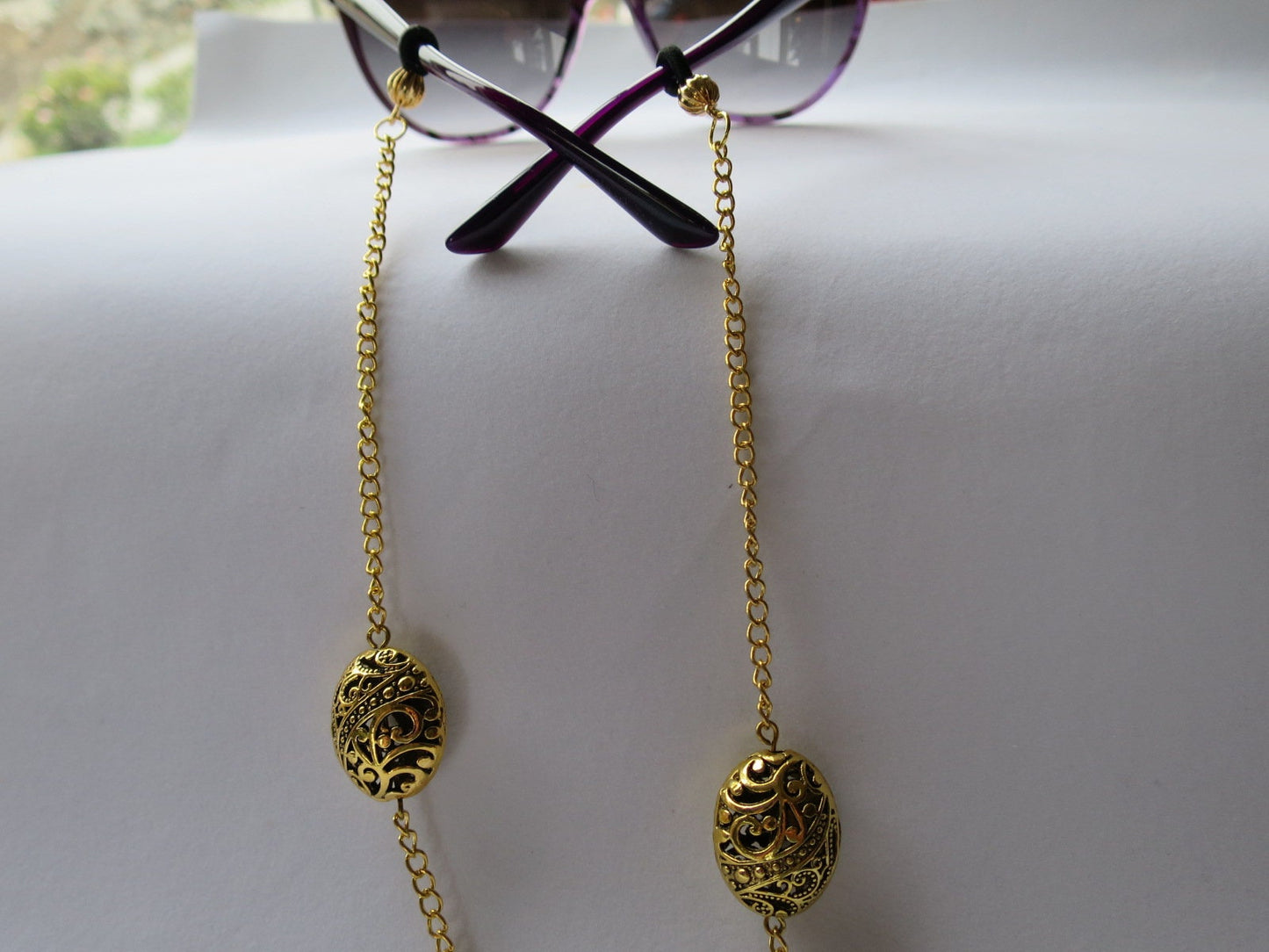 Eyeglass chain in gold finish with filigree beads