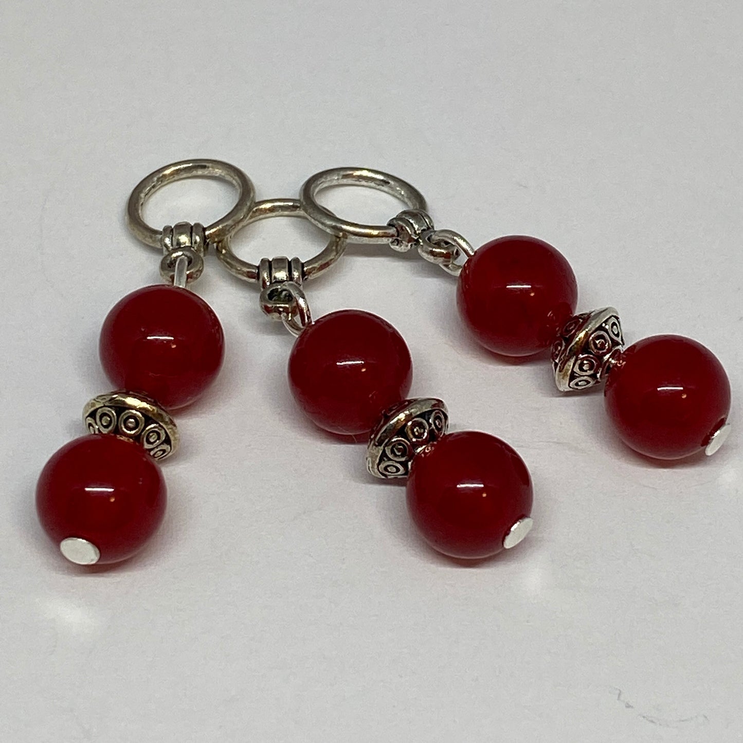 Red agates and silver knitting markers