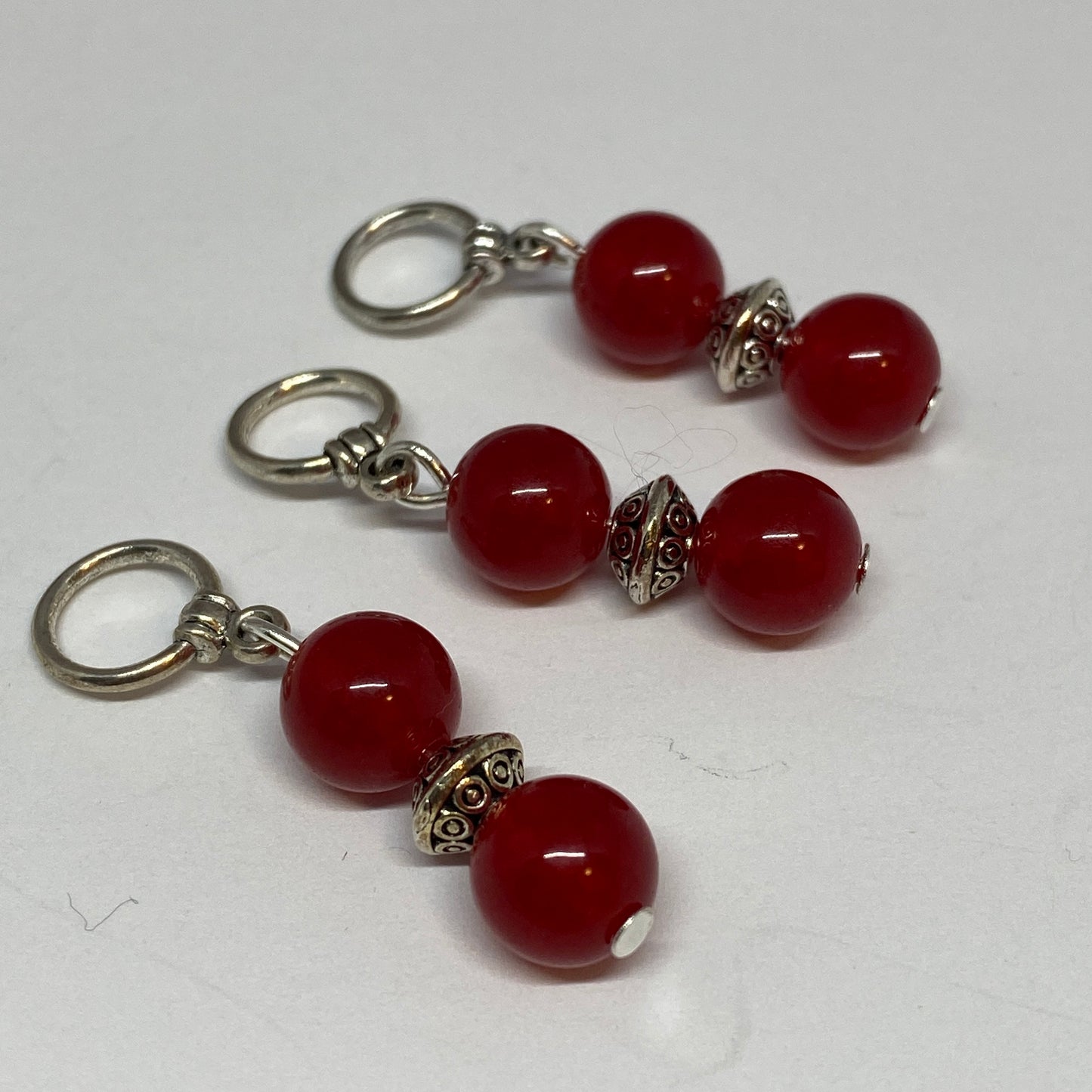 Red agates and silver knitting markers
