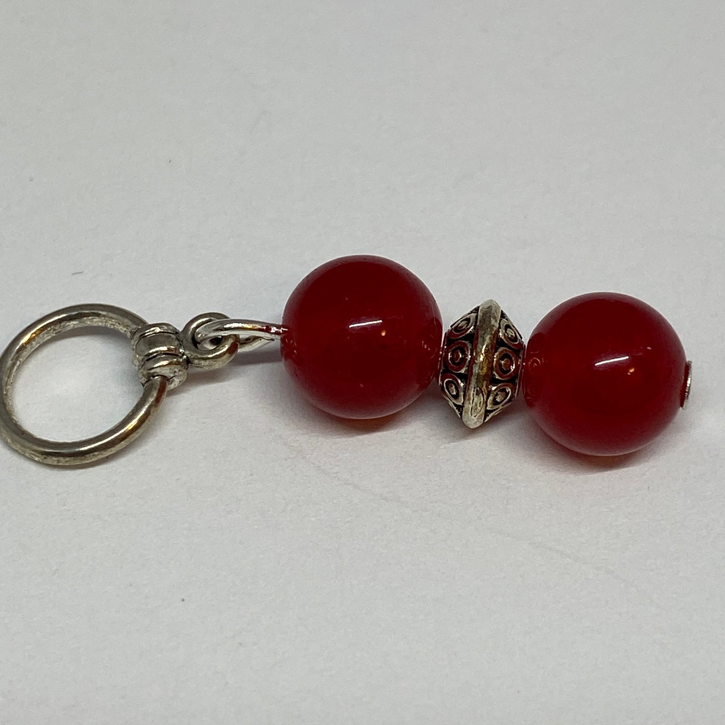 Red agates and silver knitting markers