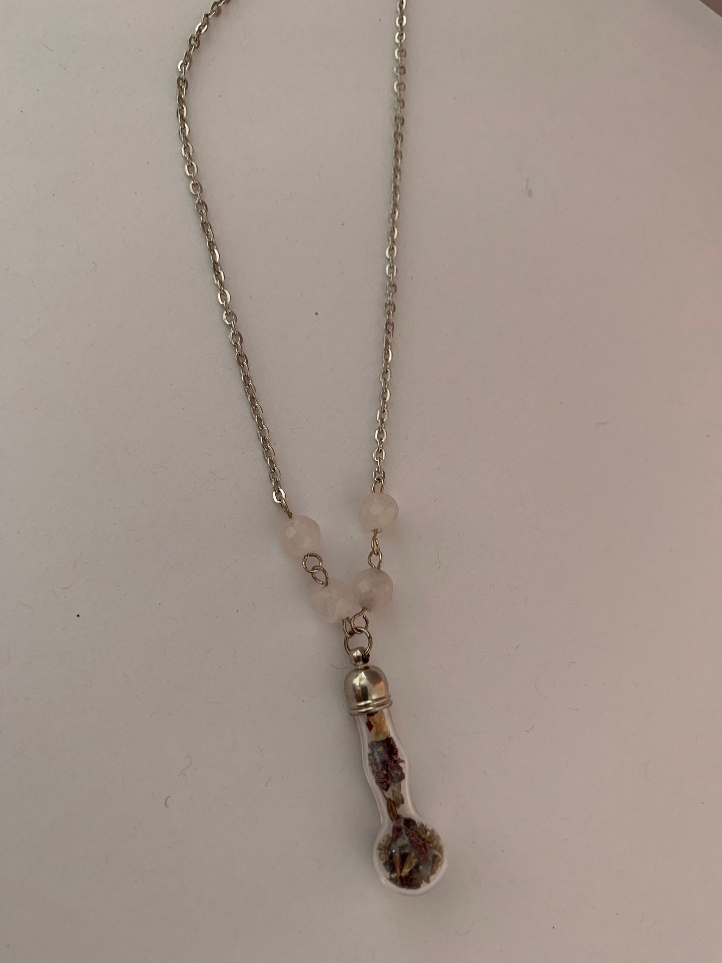 Talisman necklace, love charm spell bottle.