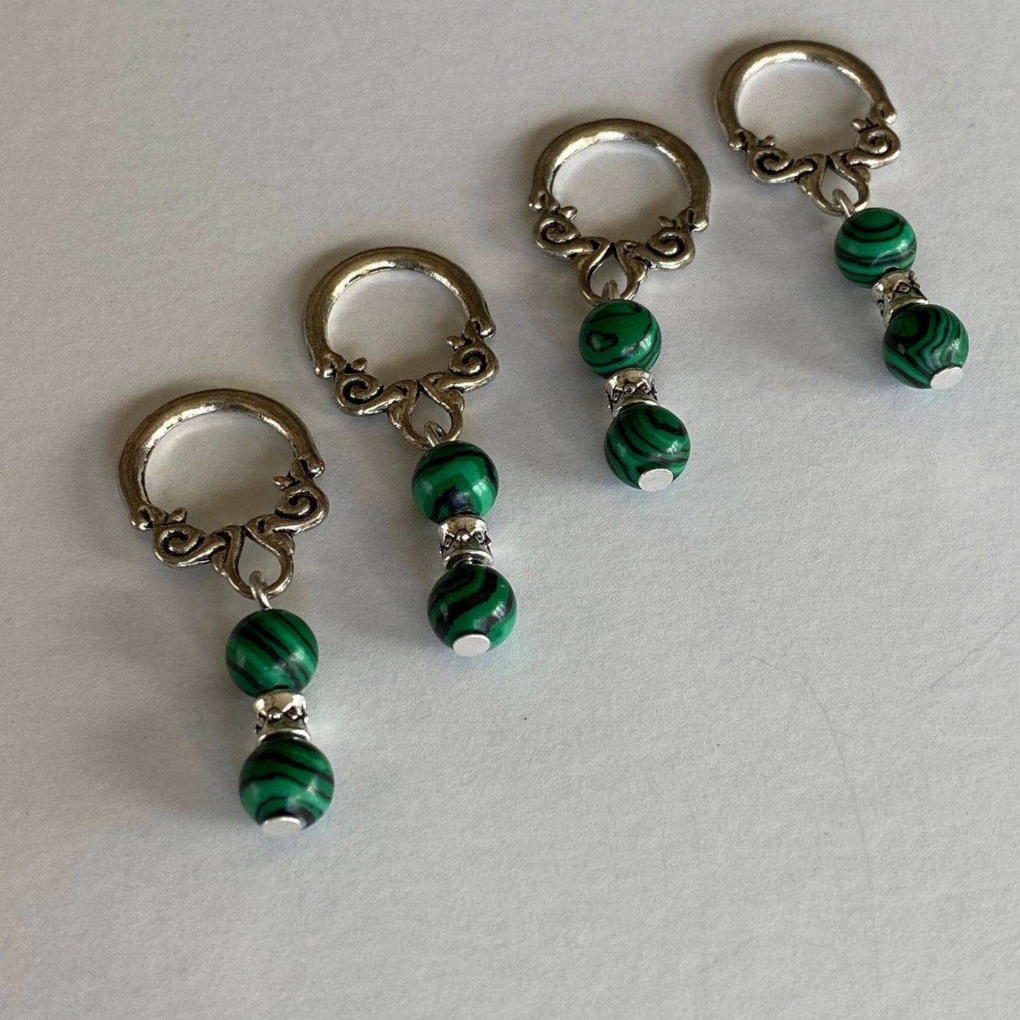 Malachite gemstone stitch markers with scroll loops